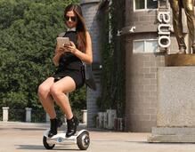 Oh what fun it is to ride in the saddle-equipped electric walkcar.